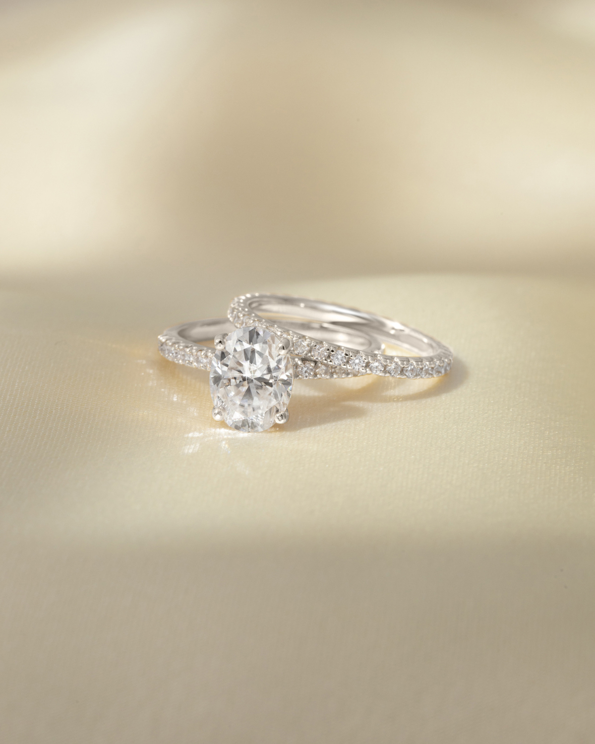 2 ct Oval Solitaire Moissanite Engagement Ring with Pavé Band in Sterling Silver