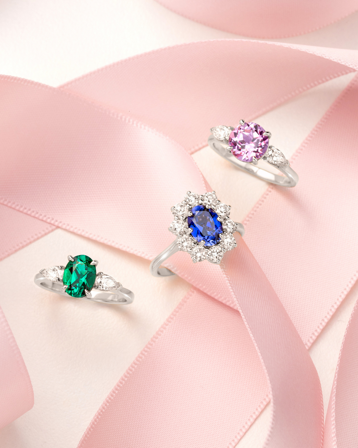 Emerald Oval Cut Three Stone Engagement Ring in Sterling Silver